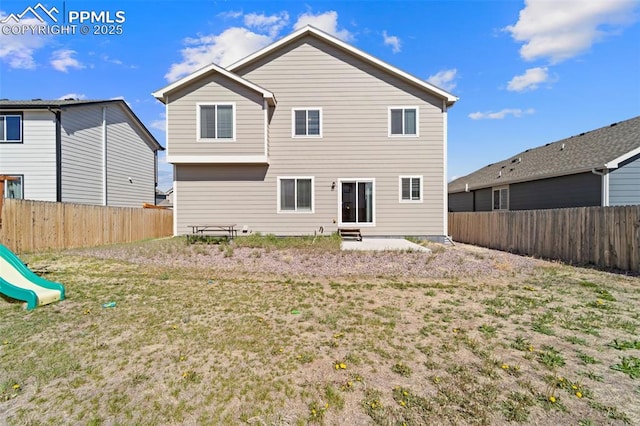 2972 Namib Dr, Colorado Springs, CO 80939 - rear view of house featuring a fenced backyard, a playground, and entry steps