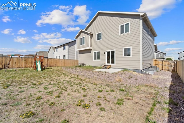 2972 Namib Dr, Colorado Springs, CO 80939 - back of house featuring a fenced backyard, a playground, and entry steps
