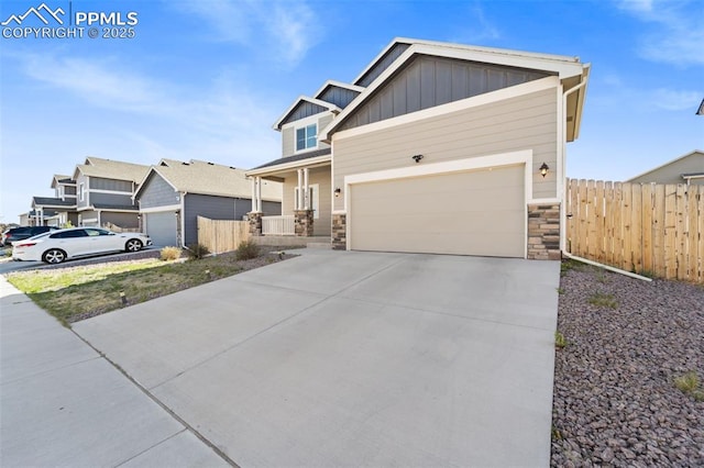 2972 Namib Dr, Colorado Springs, CO 80939 - craftsman inspired home featuring board and batten siding, fence, concrete driveway, and stone siding