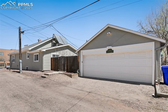 1415 E Boulder St, Colorado Springs, CO 80909 - exterior space featuring a garage and fence