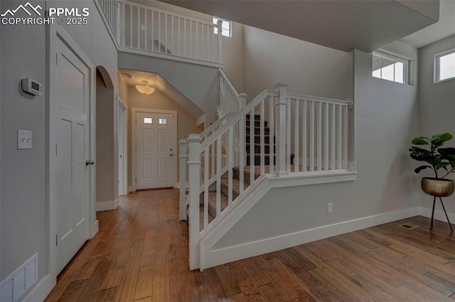 275 Eclipse Dr, Colorado Springs, CO 80905 - stairway with wood finished floors, baseboards, and a towering ceiling