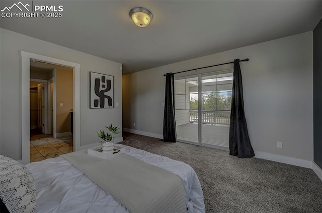 275 Eclipse Dr, Colorado Springs, CO 80905 - carpeted bedroom featuring access to exterior and baseboards