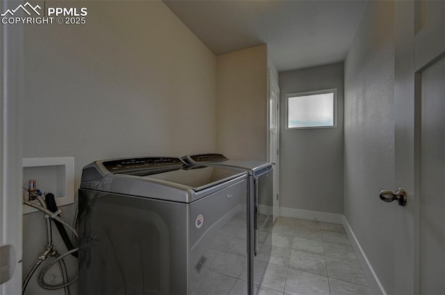 275 Eclipse Dr, Colorado Springs, CO 80905 - laundry room with washing machine and clothes dryer and baseboards