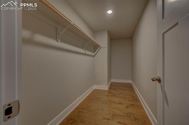275 Eclipse Dr, Colorado Springs, CO 80905 - walk in closet featuring wood finished floors