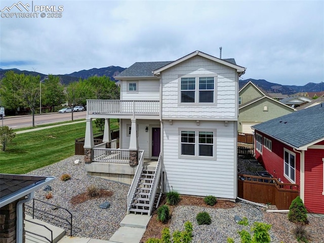 275 Eclipse Dr, Colorado Springs, CO 80905 - view of front facade with a mountain view, covered porch, and stairway