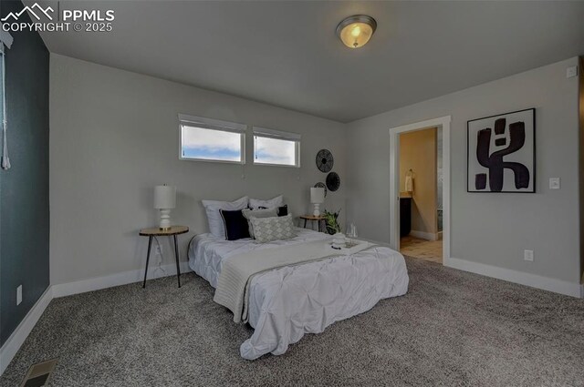 275 Eclipse Dr, Colorado Springs, CO 80905 - carpeted bedroom with baseboards and connected bathroom