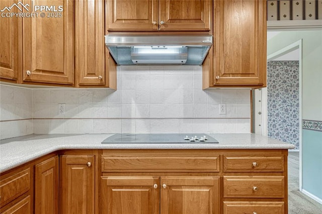 10 Gold Coin Ct, Colorado Springs, CO 80919 - kitchen with light countertops, ventilation hood, brown cabinets, and black electric stovetop