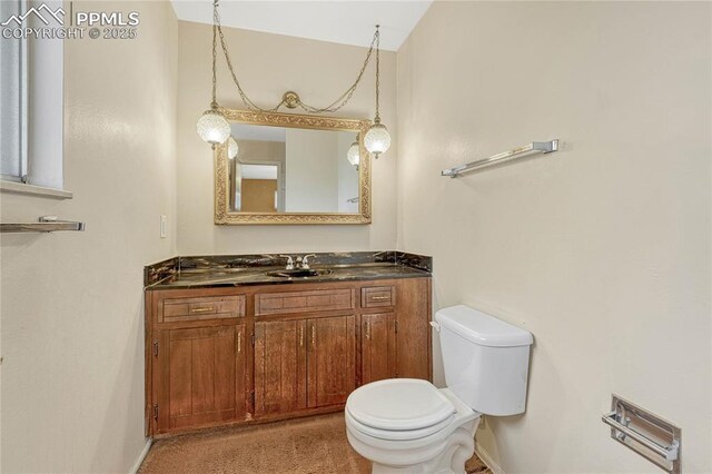10 Gold Coin Ct, Colorado Springs, CO 80919 - half bathroom with toilet, baseboards, and vanity