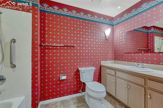 10 Gold Coin Ct, Colorado Springs, CO 80919 - full bath with toilet, wallpapered walls, baseboards, and vanity