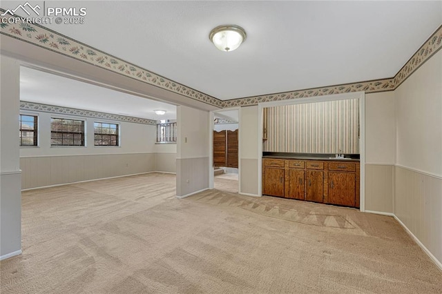 10 Gold Coin Ct, Colorado Springs, CO 80919 - empty room with wainscoting and light carpet