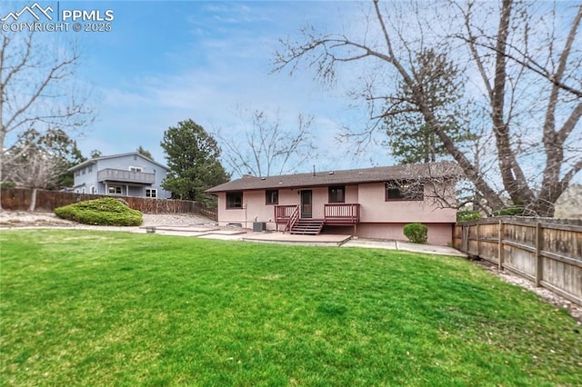 10 Gold Coin Ct, Colorado Springs, CO 80919 - back of property with a patio, a fenced backyard, stucco siding, and a yard