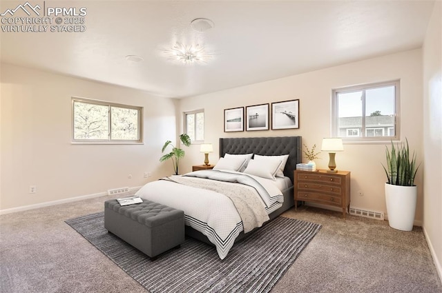 bedroom with baseboards, carpet, and visible vents