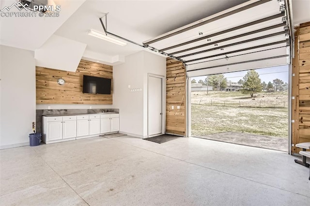 garage featuring wooden walls