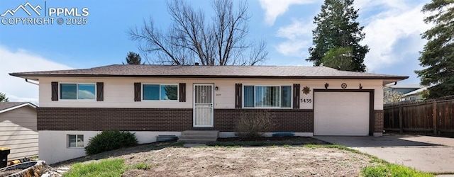 3435 Montebello Dr, Colorado Springs, CO 80918 - ranch-style home with an attached garage, fence, brick siding, and concrete driveway