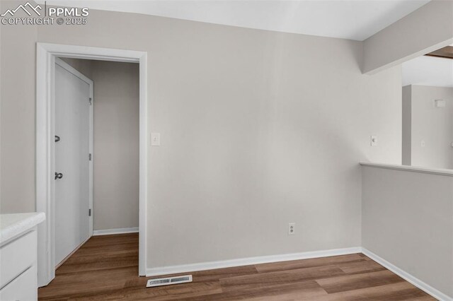 3435 Montebello Dr, Colorado Springs, CO 80918 - unfurnished room featuring visible vents, baseboards, and wood finished floors