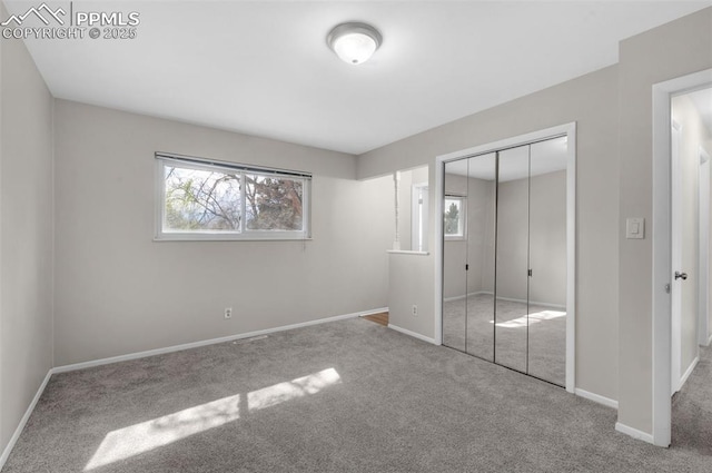 3435 Montebello Dr, Colorado Springs, CO 80918 - unfurnished bedroom featuring baseboards, carpet flooring, and multiple windows