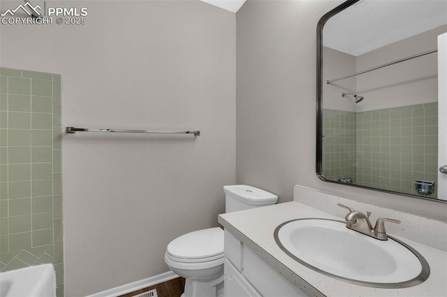 3435 Montebello Dr, Colorado Springs, CO 80918 - full bath with toilet, wood finished floors, and vanity