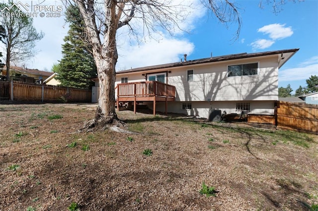 3435 Montebello Dr, Colorado Springs, CO 80918 - back of house with a fenced backyard and a wooden deck