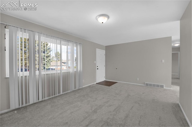 3435 Montebello Dr, Colorado Springs, CO 80918 - unfurnished living room with visible vents, carpet flooring, and baseboards