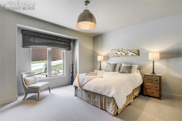 carpeted bedroom with baseboards