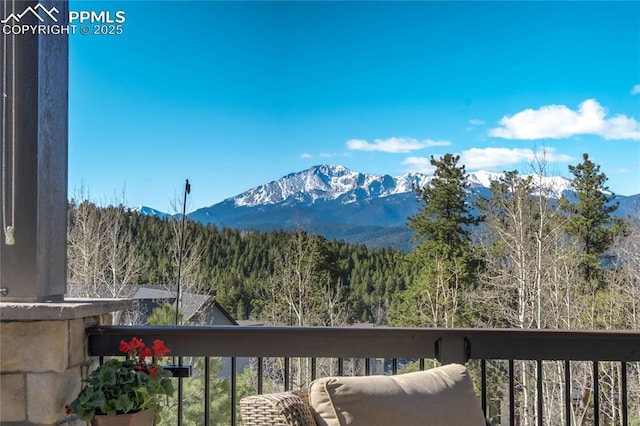 property view of mountains featuring a wooded view