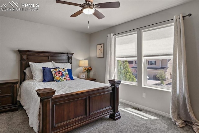 bedroom featuring baseboards, ceiling fan, and carpet