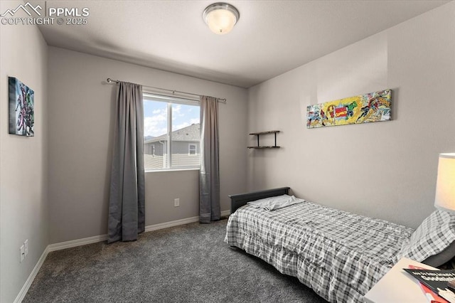 carpeted bedroom featuring baseboards