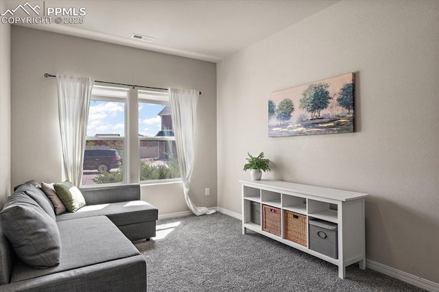 living room featuring carpet floors, baseboards, and visible vents