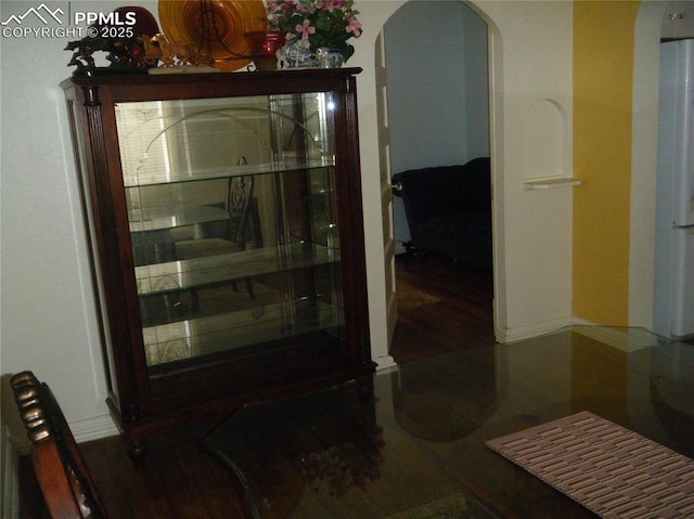 415 Veta Ave, Pueblo, CO 81004 - interior space with arched walkways, baseboards, and wood finished floors