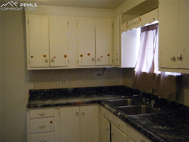 415 Veta Ave, Pueblo, CO 81004 - kitchen with a sink, white cabinets, and dark countertops