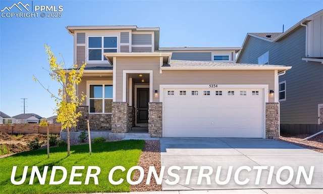 9803 Blaurock Dr, Fountain, CO 80817 - prairie-style home featuring concrete driveway, a front yard, stone siding, and a garage