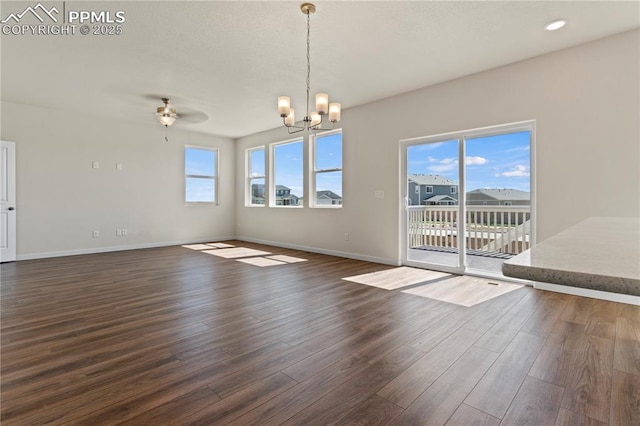 9803 Blaurock Dr, Fountain, CO 80817 - unfurnished dining area featuring dark wood-type flooring, recessed lighting, baseboards, and ceiling fan with notable chandelier