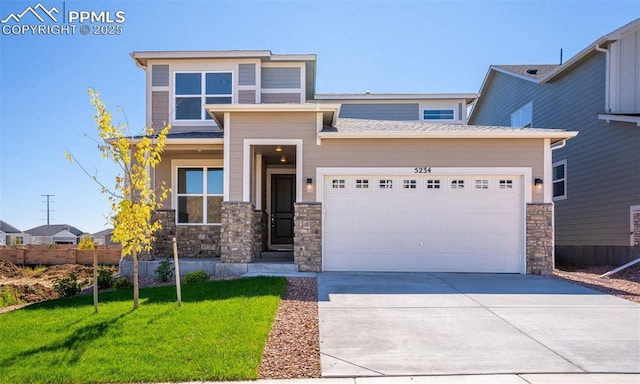 9803 Blaurock Dr, Fountain, CO 80817 - prairie-style home with a garage, driveway, a front lawn, and stone siding