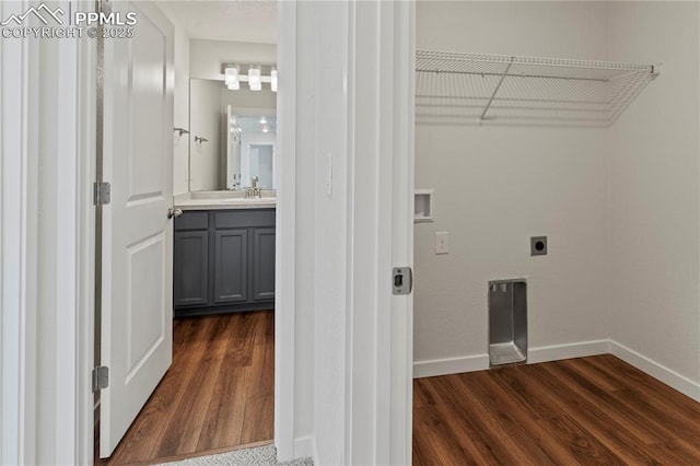 9803 Blaurock Dr, Fountain, CO 80817 - laundry area featuring baseboards, hookup for an electric dryer, dark wood-style floors, and a sink