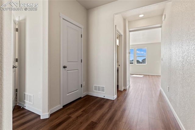 9803 Blaurock Dr, Fountain, CO 80817 - hall featuring visible vents, dark wood-style flooring, and baseboards