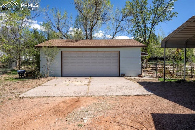 detached garage with fence