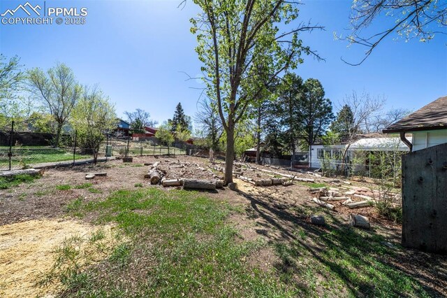 view of yard with fence