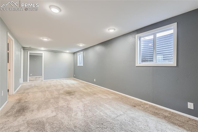 basement featuring carpet and baseboards