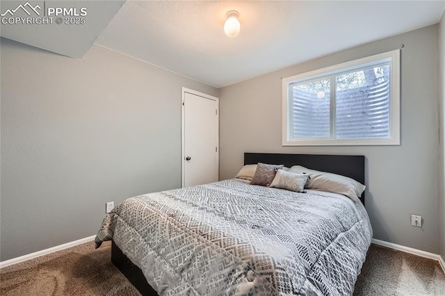 bedroom with carpet and baseboards