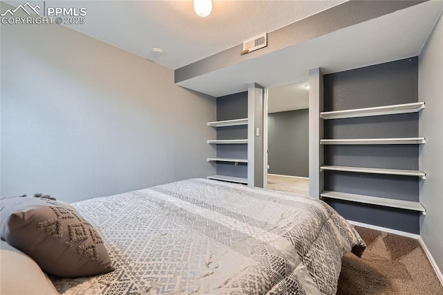 carpeted bedroom with baseboards