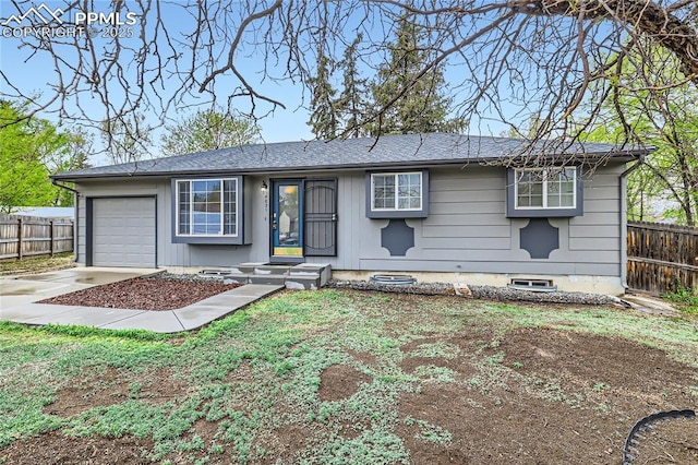 single story home with fence, a garage, and driveway
