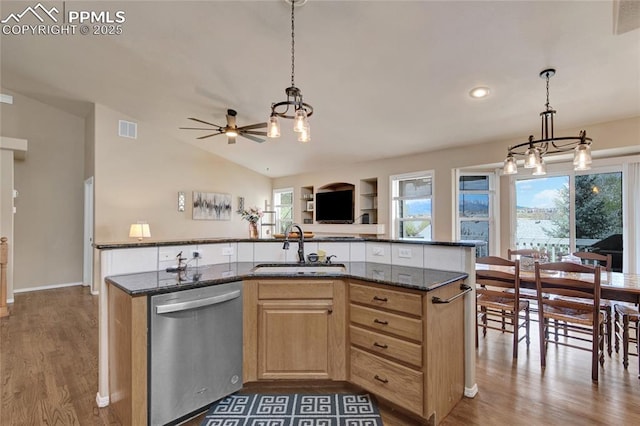 kitchen featuring a sink, dishwasher, a kitchen island with sink, wood finished floors, and visible vents