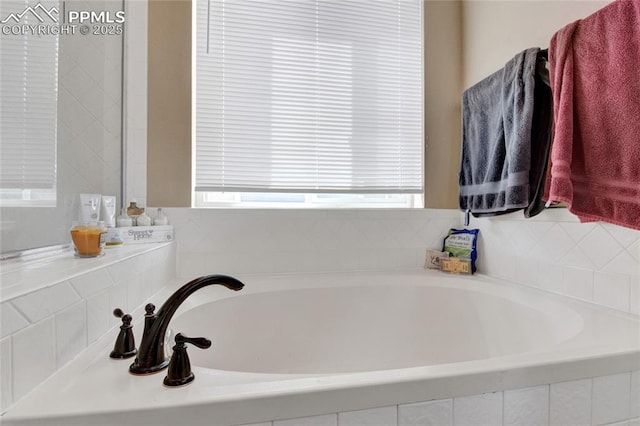bathroom with a garden tub