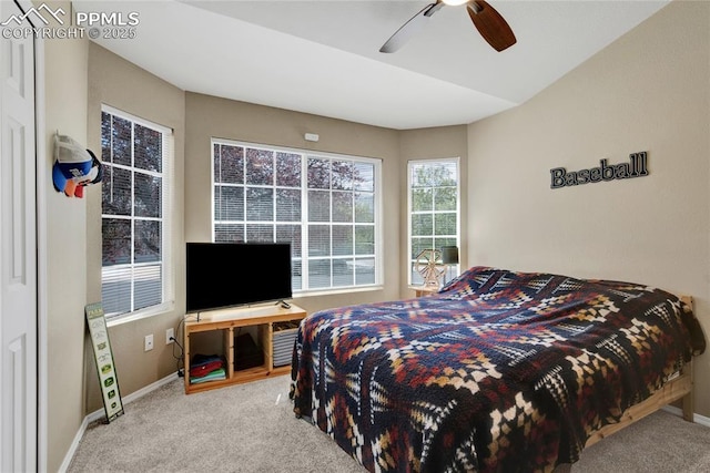 bedroom featuring a ceiling fan, baseboards, and carpet