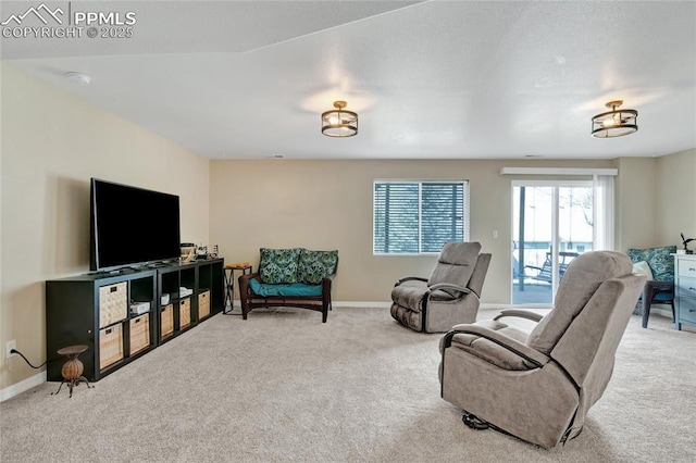 carpeted living room featuring baseboards