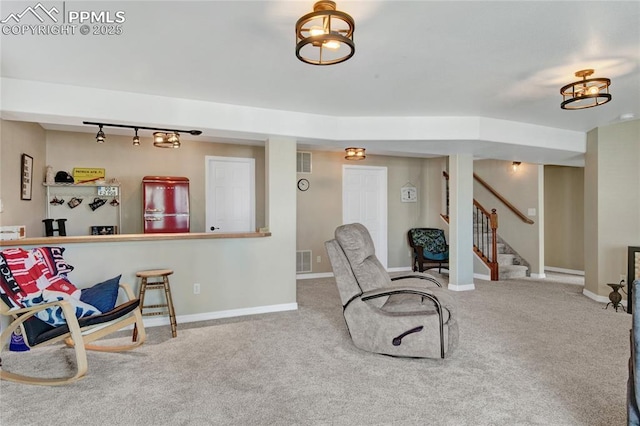 living area featuring stairway, carpet floors, and visible vents