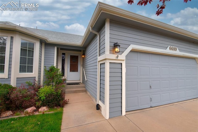 property entrance with an attached garage
