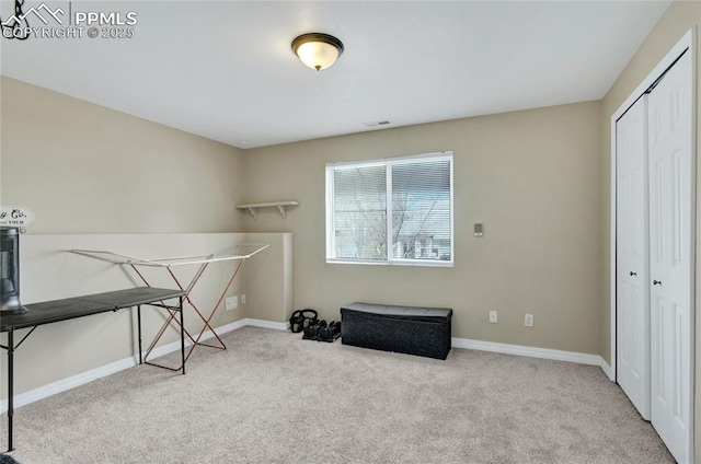 carpeted bedroom with baseboards, a closet, and visible vents