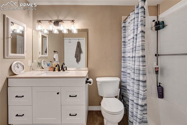 bathroom featuring toilet and vanity