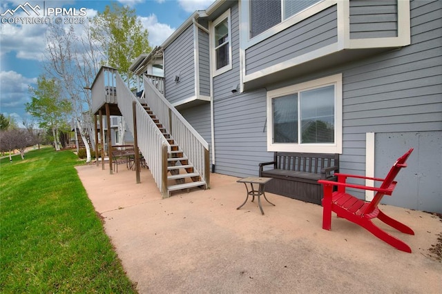 view of patio with stairway and a deck